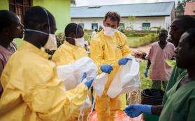 An IPC manager instructs MSF staff on how to use medical equipment.