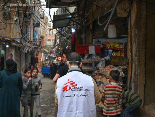 A MSF staff worker stands in a refugee camp in South Beirut, Lebanon