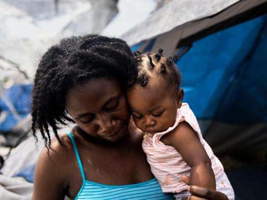 A woman holds her baby daughter in Mexico. 
