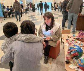 An MSF team member conducts psychological first aid for two people who fled Nagorno-Karabakh.