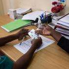 A nurse holds medication for an abortion with pills in Mozambique.