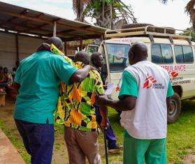 Two MSF medical staff help a patient in South Sudan 