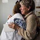 MSF psychologist Vika hugs Antonina Sakhnovska, an MSF mental health patient in Kharkiv, when she begins to cry when she remembers her husband, who died in the war.