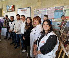 Smiling staff at the opening of a new hepatitis C clinic in Yerevan