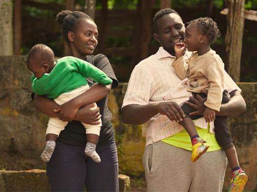 Michael Karongo with his wife Mary Wairimu—his greatest supporter in his recovery journey—and their children in Kenya.