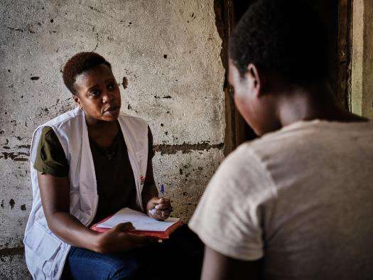 Miriam Mbwana, a mental health counselor with MSF, talks to a sex worker seeking psychological support in Malawi