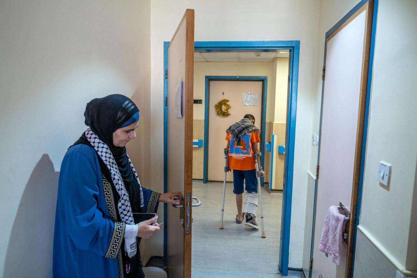 Abdul Rahman, a Palestinian boy from the north of Gaza walks through the halls of MSF's hospital in Amman, Jordan.