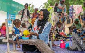 Mental health activity manager Saidi Nabiha and her colleague Zamzam, a Sudanese counselor, provide physiotherapeutic care to patients in the malnutrition ward to counteract developmental delays arising from malnutrition. 