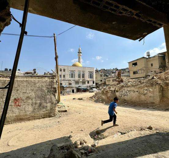 A child runs through Nur Shams refugee camp in Tulkarem.