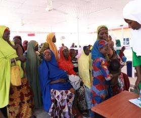 Parents wait in line at the Kombotso outpatient feeding center in Nigeria.
