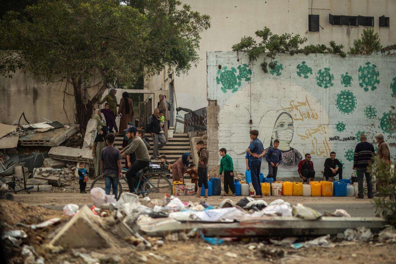 Palestinians line up for water in Gaza City.