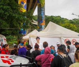 Migrants wait next to the US border in Mexico. 