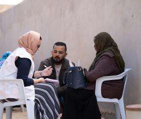 MSF staff speak with migrants in Libya.