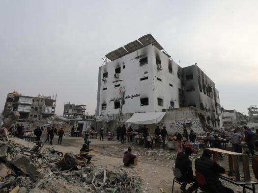 Tents next to the damaged exterior of Kamal Adwan Hospital in Gaza. 