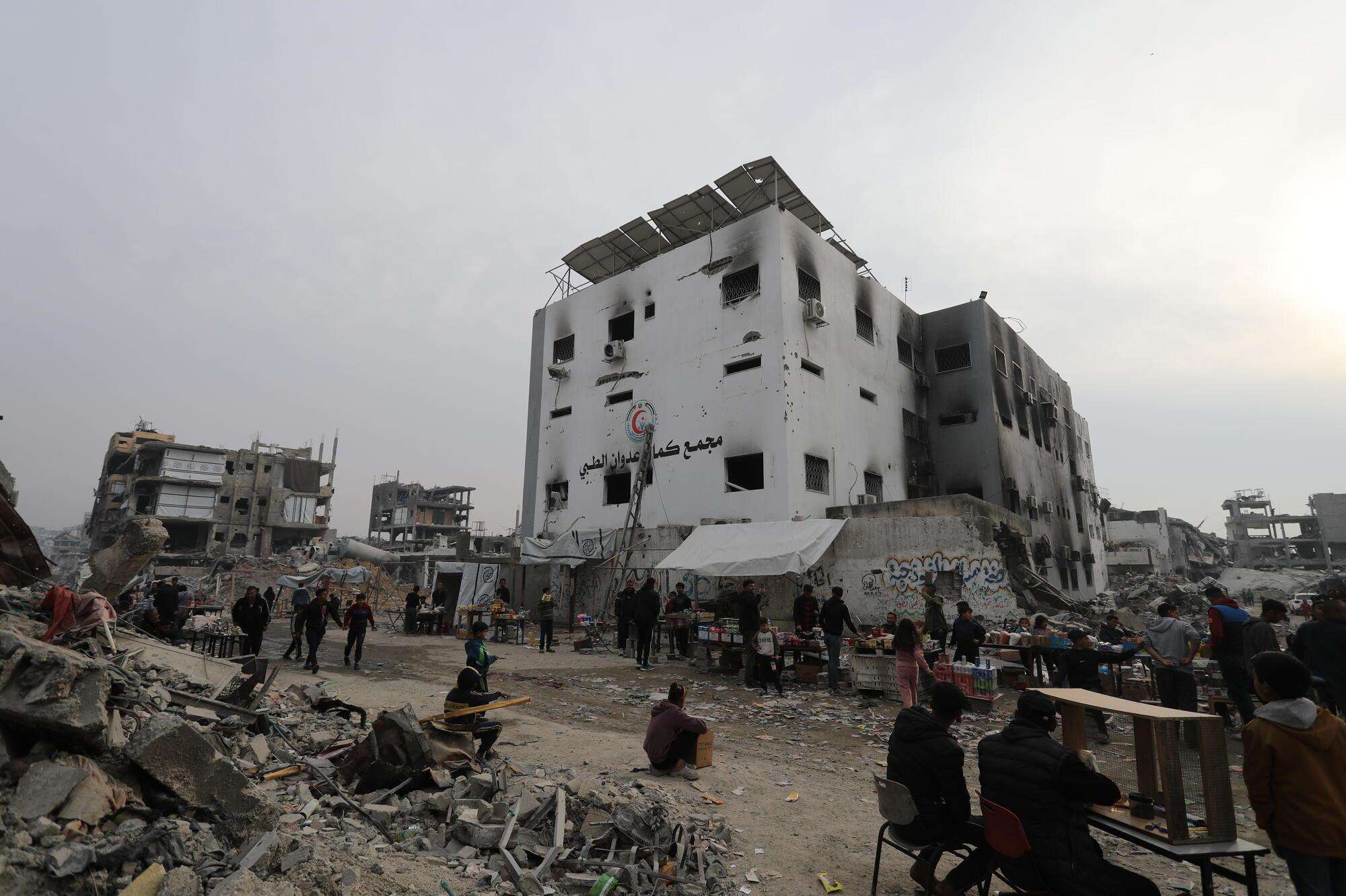 Tents next to the damaged exterior of Kamal Adwan Hospital in Gaza. 