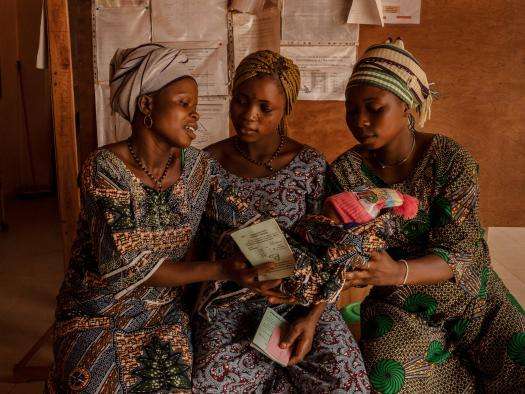 A new mother holds her baby in Benin. 
