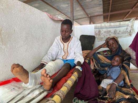 A boy wounded while fleeing Zamzam camp, North Darfur, in April. 