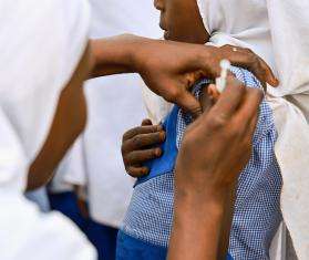 A child gets vaccination for meningitis. 