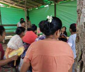 Participants at a group psychosocial care session run by MSF mental health counselors on the grounds of a High School near Mandalay city.