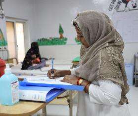 Nurse checking a patient's history