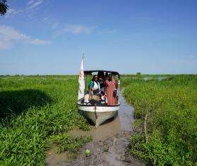 MSF outreach team traveling by boat to a remote village in Ulang, South Sudan