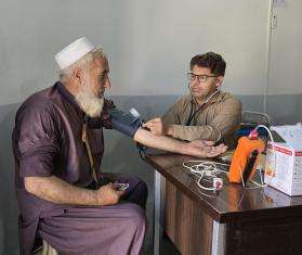 MSF nurse checks blood pressure