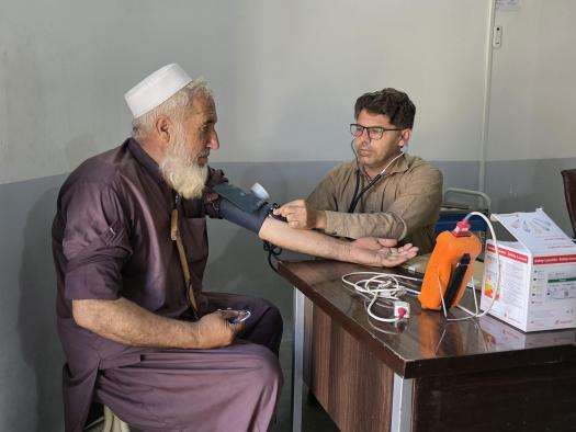 MSF nurse checks blood pressure