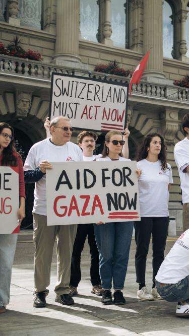 Patient sits in a chair reading