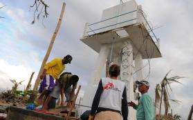 An MSF team cleans a well in the Philippines.