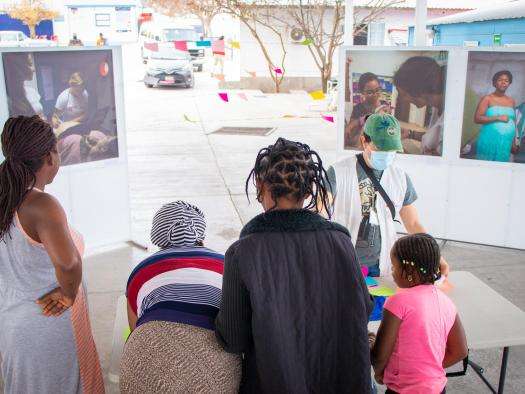 Migrants gather around a table