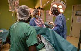 An MSF surgical team performs a cesarean