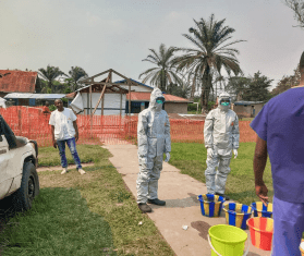 MSF staff set up infection control at an ebola treatment center in DR Congo. 