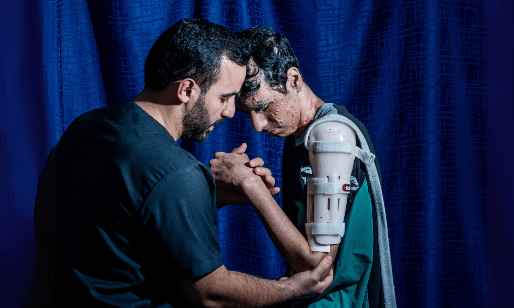 An injured Palestinian boy undergoes treatment from MSF in Jordan.