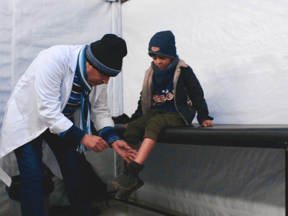Abed al Raheem, an MSF pediatrician, examines a child at Mawasi Rafah primary health care clinic in southern Gaza.