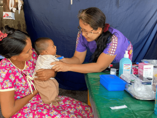 MSF teams check a baby while responding to the Myanmar earthquake.