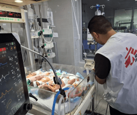 Premature babies share an incubator in northern Gaza, Palestine. 