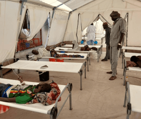 An MSF doctor treats cholera patients in Sudan. 