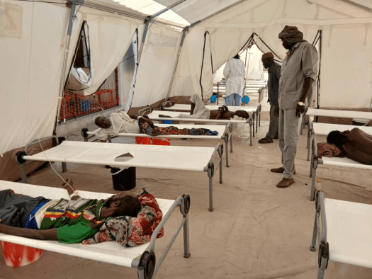 An MSF doctor treats cholera patients in Sudan. 