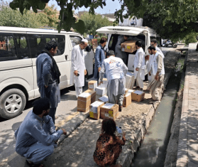 MSF staff distribute supplies in Afghanistan. 